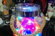 large glass candle lantern with coloured lights