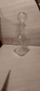 Art deco glass whiskey decanter with lid,,buyer collects or pays postage thank you, good patina condition,,sold as is, see pictures for condition,,