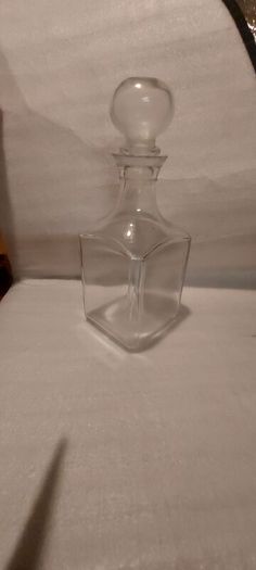 Art deco glass whiskey decanter with lid,,buyer collects or pays postage thank you, good patina condition,,sold as is, see pictures for condition,,