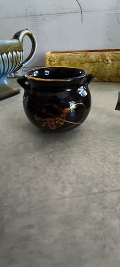 4 Irish made items- Ceramic Arklow pottery ashtray 32.00 euro.  Vintage Ceramic Arklow pottery small bowl 22.00 euro. Carrig ware pottery flower dish holder / vase 28.00 euro.  vintage Wade Irish Porcelain double-handled pedestal mantle vase or planter. 4