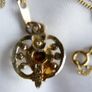 Gold Plated Necklace with Purple Stone. Stone is Multifaceted & Sparkles in the Light. Image 7