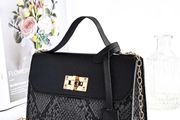 Black snakeskin twist lock bag
