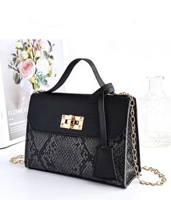 Black snakeskin twist lock bag