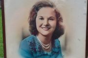 Archival, hand-colored portrait of a woman