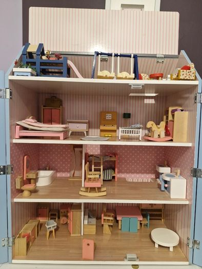 Wooden dolls house with furniture