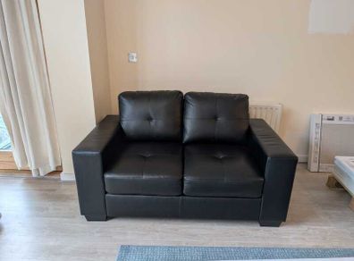 2-seater couch (black) in excellent condition (200 EUR negotiable)
