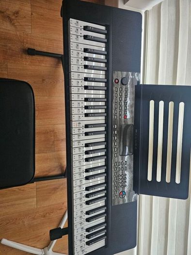 Barely used 61 keys  keyboard with stand and stool in perfect condition, model no SM-61K