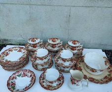 Vintage tea set, 1940's or earlier, with gold edging and floral pattern. Cafe wedding decor