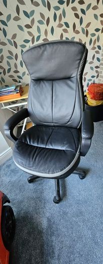 High back leather executive office/ Desk Chair- adjustable height and padded arms.