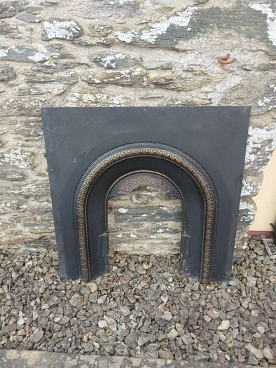 Timber surround with cast iron insert for fireplace