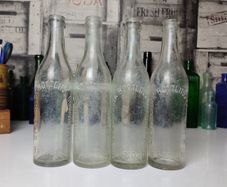 324 - Set of 4 Vintage Clear Glass Collectible Decorative West Cork Bottling Company Bandon Bottles