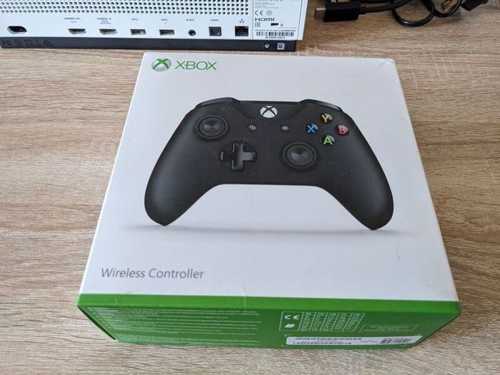 Xbox One S 1TB with controller and cables.