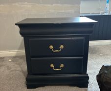 Pair black painted bedside lockers