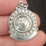 A silver medal or pendant depicting the Irish harp Image 3
