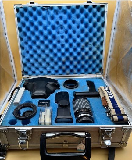 A Cased Olympus OM-10 Set