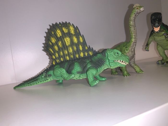 Three dinosaur toys