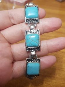 Bracelet with a blue stone.