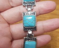 Bracelet with a blue stone.