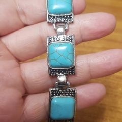 Bracelet with a blue stone.