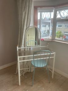 dresser with mirror and chair
