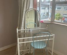 dresser with mirror and chair