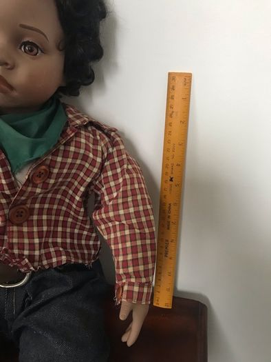Lifelike doll in cute western clothes