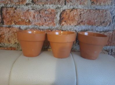 citronella candles in terracotta pots