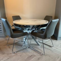 Round marble effect dining table and chairs
