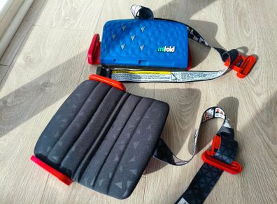 Two mifold portable booster seats - blue and purple