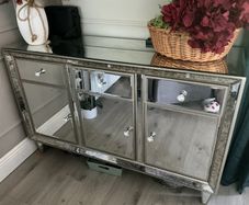 Mirrored sideboard with three doors and drawers