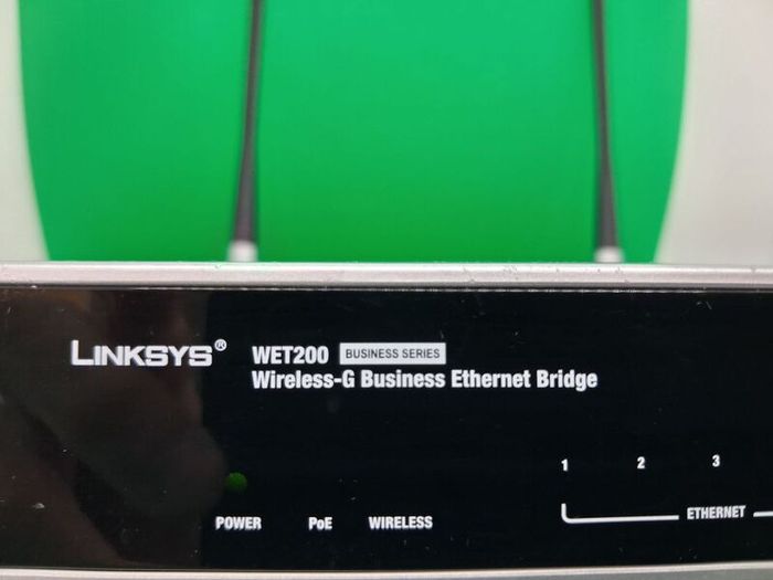 Postage - Linksys Cisco WET200 Wireless Ethernet Bridge Router.