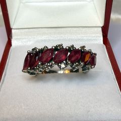 Beautiful vintage silver ring with natural rubies and diamonds.