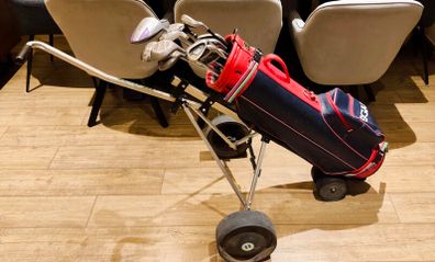 Golf Clubs with Golf Bag and Cart.