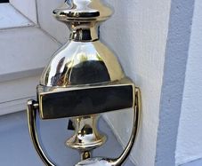 old brass door  striker
