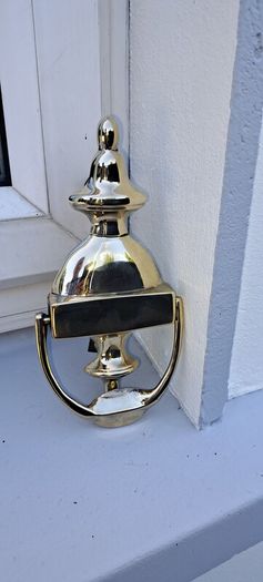 old brass door  striker