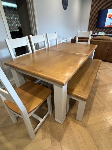 Large extendable 8 seater table with 5 chairs and a bench