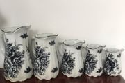 Set of 5 graduated black white floral jugs