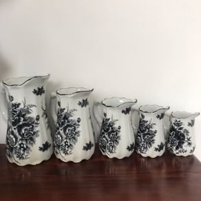 Set of 5 graduated black white floral jugs