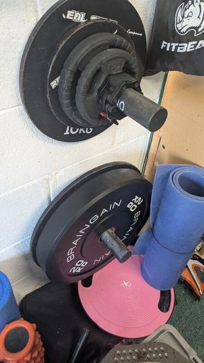 gym equipment - barbell - squat rack - dumbbells
