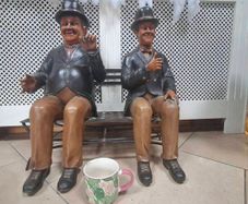 Laurel & Hardy Figures On Bench