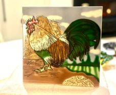 Cockerel on a tile.
