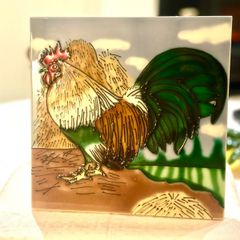 Cockerel on a tile.
