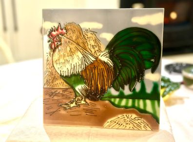 Cockerel on a tile.