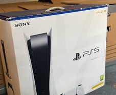 PlayStation 5 box with two books