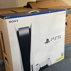 PlayStation 5 box with two books