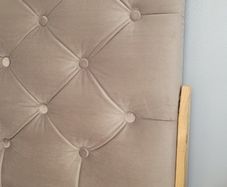 Single bed with cushioned headboard