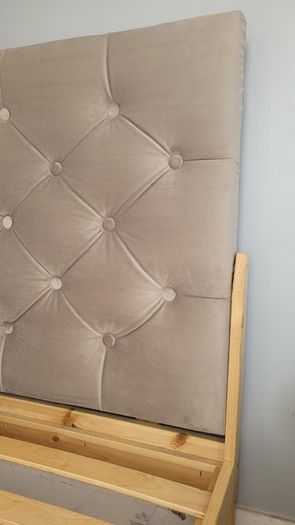 Single bed with cushioned headboard