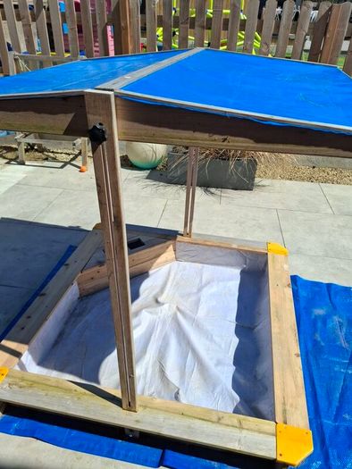sand pit with canopy roof