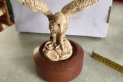 Varnished Resin Golden Eagle Figurine On Wooden Round Plinth.