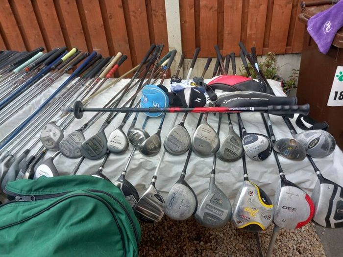 A selection of golf clubs and bags. NOT SELLING SEPARATE